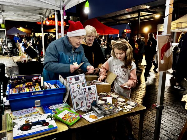 Neston Town Councillors giving prizes for the Christmas trail